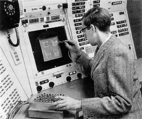 Ivan Sutherland using sketchpad with the light pen, 1962.